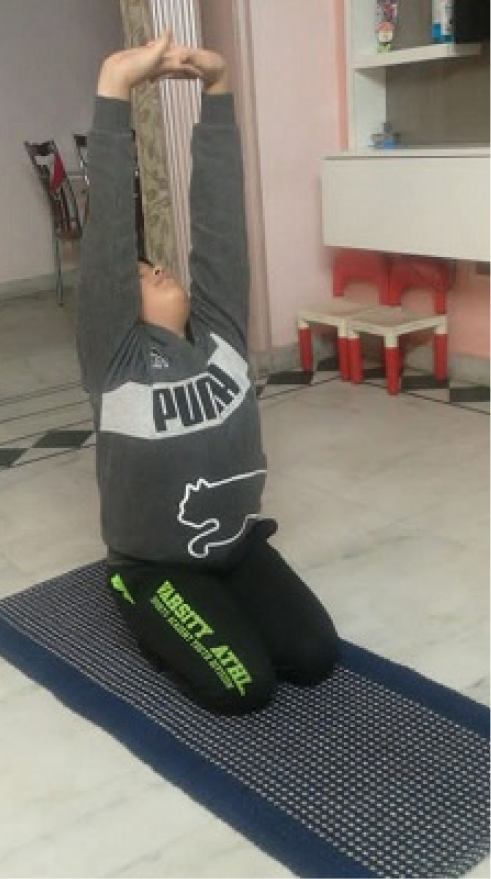 A person doing yoga indoors